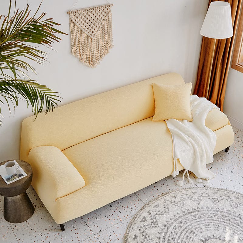 Détail du tissu jacquard déperlant jaune pâle sur canapé
