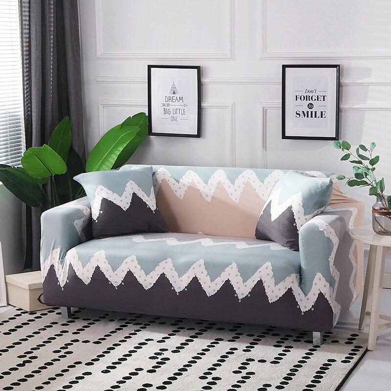 Housse extensible grise sur canapé droit moderne