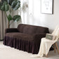 Housse marron extensible sur canapé trois places
