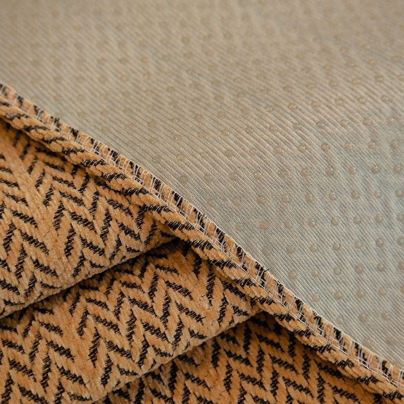 Détail du motif chevron sur la housse de canapé