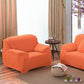 Détail du tissu extensible orange sur un canapé d'angle