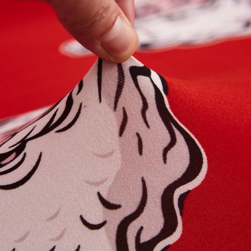 Housse de canapé extensible rouge avec motifs de Noël