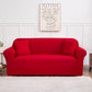 Housse rouge s'adaptant parfaitement à un canapé moderne