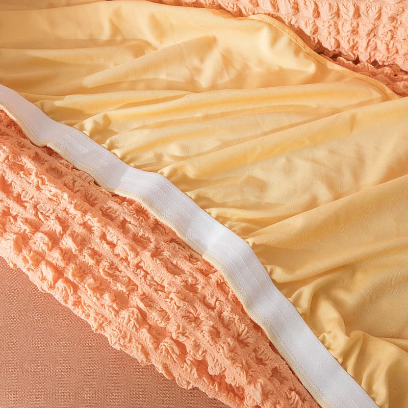Détail du tissu résistant de la housse de canapé saumon