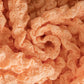 Texture du tissu extensible saumon en gros plan