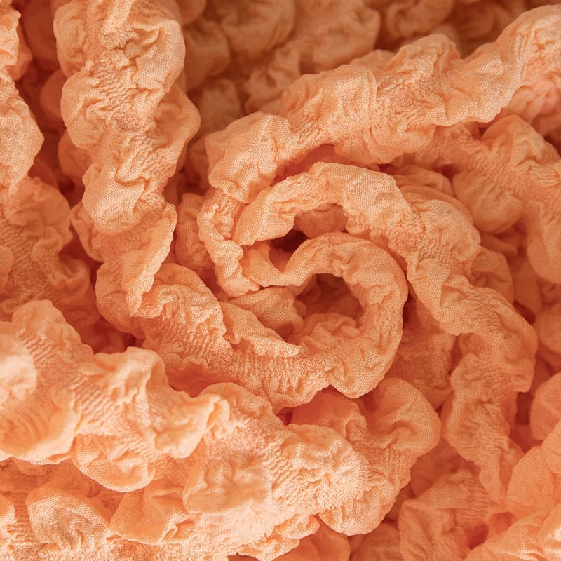 Texture du tissu extensible saumon en gros plan