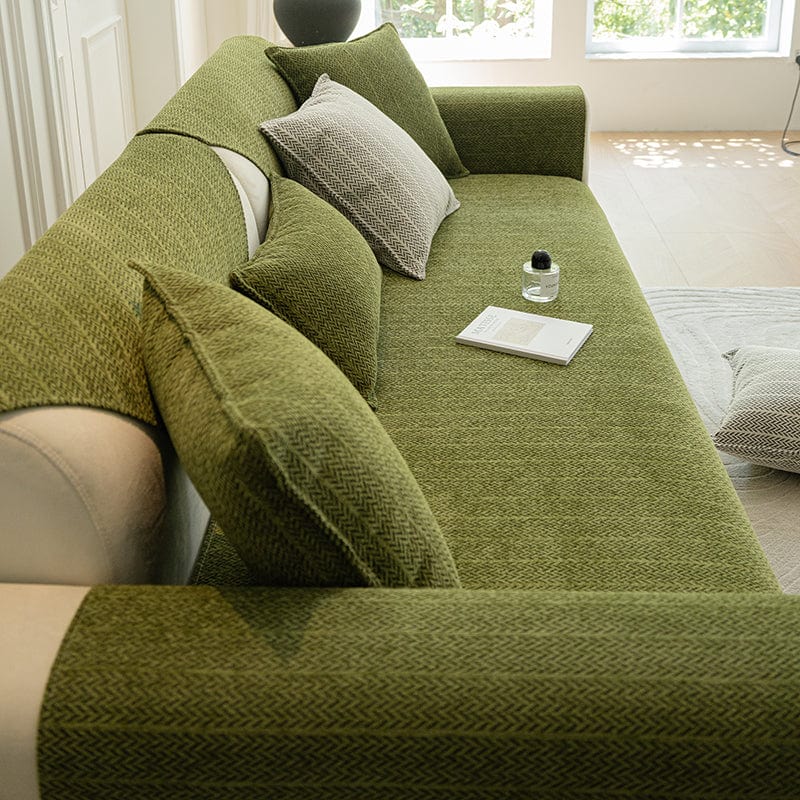 Vue rapprochée du tissu Herringbone vert sur la housse de canapé