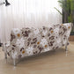Housse extensible marron à motifs floraux sur canapé-lit