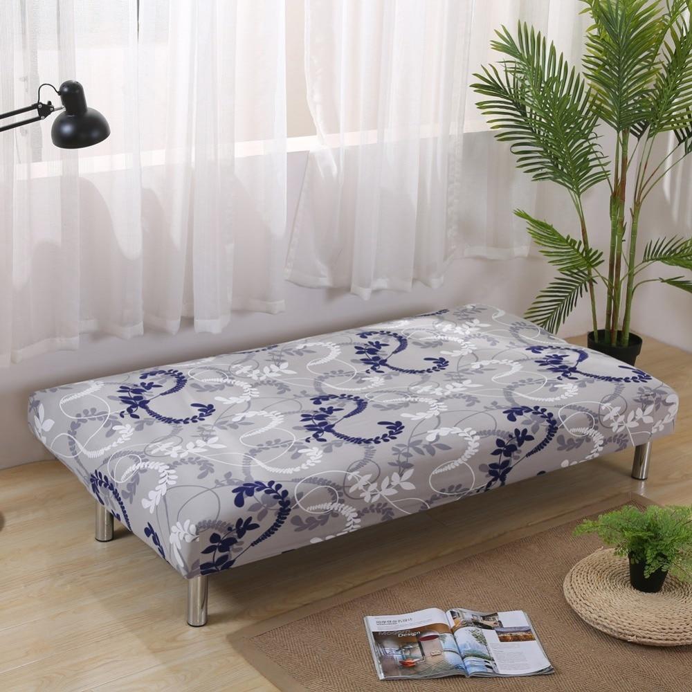 Housse extensible à motif floral sur canapé-lit