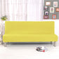 Housse jaune extensible sur canapé-lit en position assise
