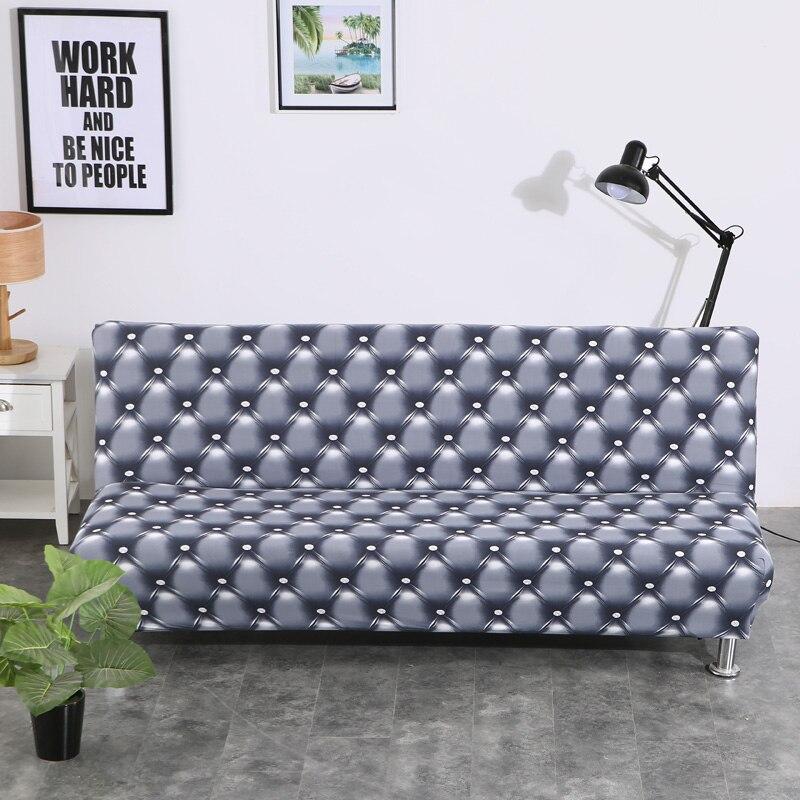 Housse extensible beige sur canapé-lit en mode assis