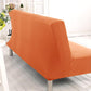 Housse orange ajustée sur canapé-lit convertible en mode ouvert