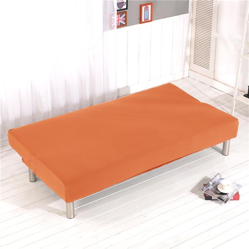 Détail du tissu élastique orange sur canapé convertible