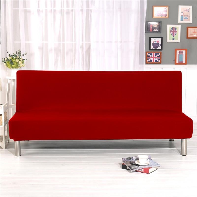 Housse rouge extensible sur canapé-lit en position fermée