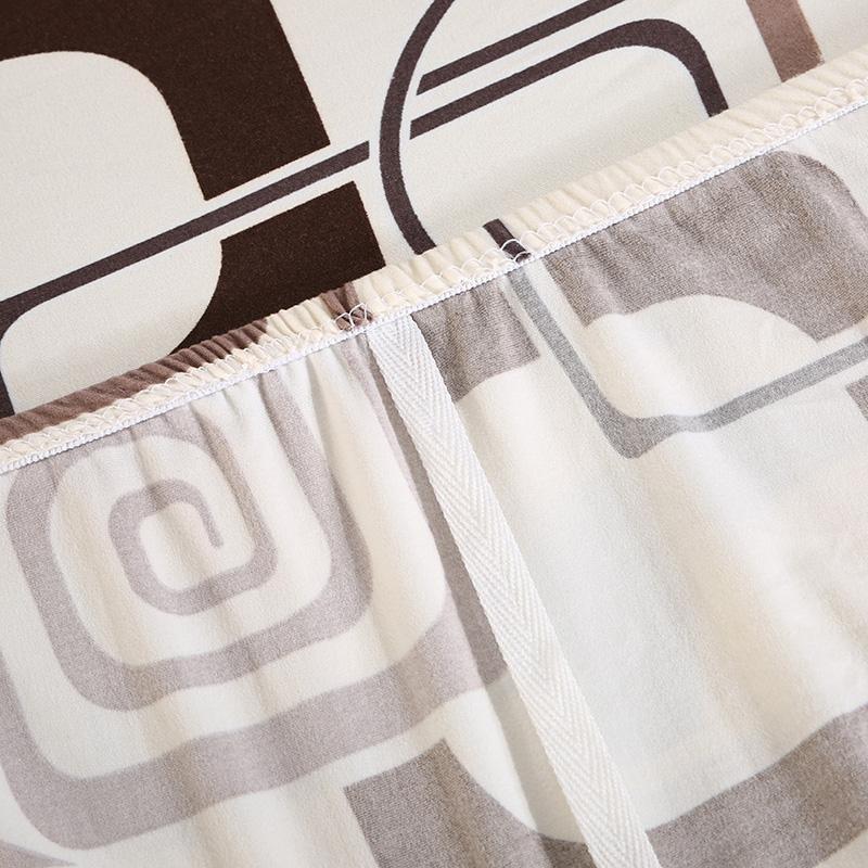 Housse extensible sur canapé-lit ouvert, motif seventies