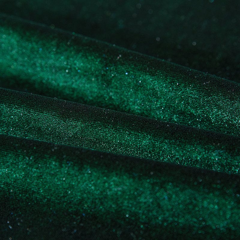Vue latérale d'un canapé-lit recouvert de velours vert