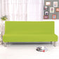 Housse verte extensible sur un canapé-lit fermé