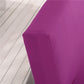 Housse violette installée sur un canapé-lit en position ouverte