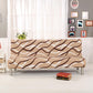 Housse extensible grise sur canapé-lit en position assise