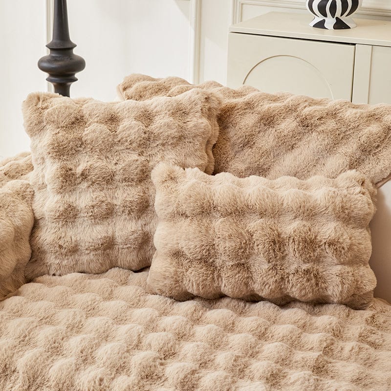 Gros plan sur la texture douce de la housse beige