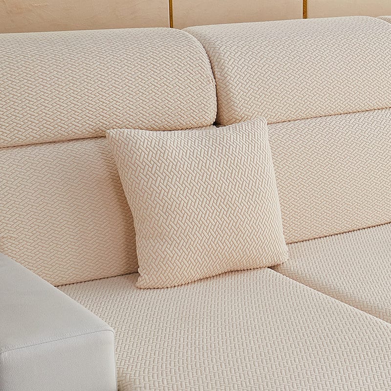 Housse de coussin beige en laine avec texture visible