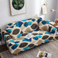 Housse de coussin extensible beige sur canapé moderne