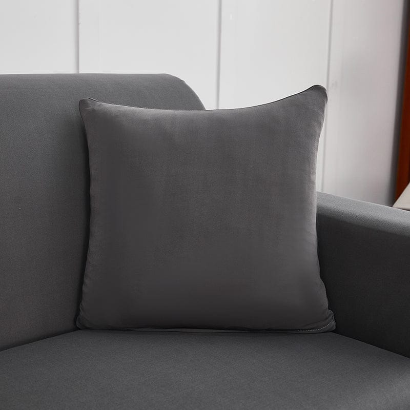 Deux housses de coussin gris anthracite sur fond blanc