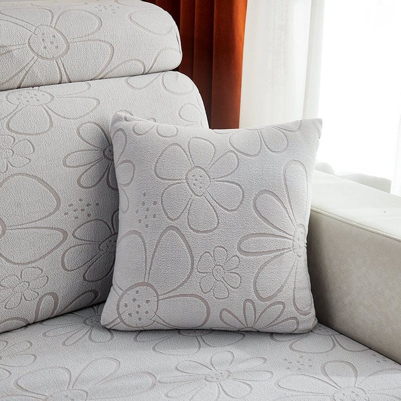 Housses de coussin grises avec motif floral, vue de face