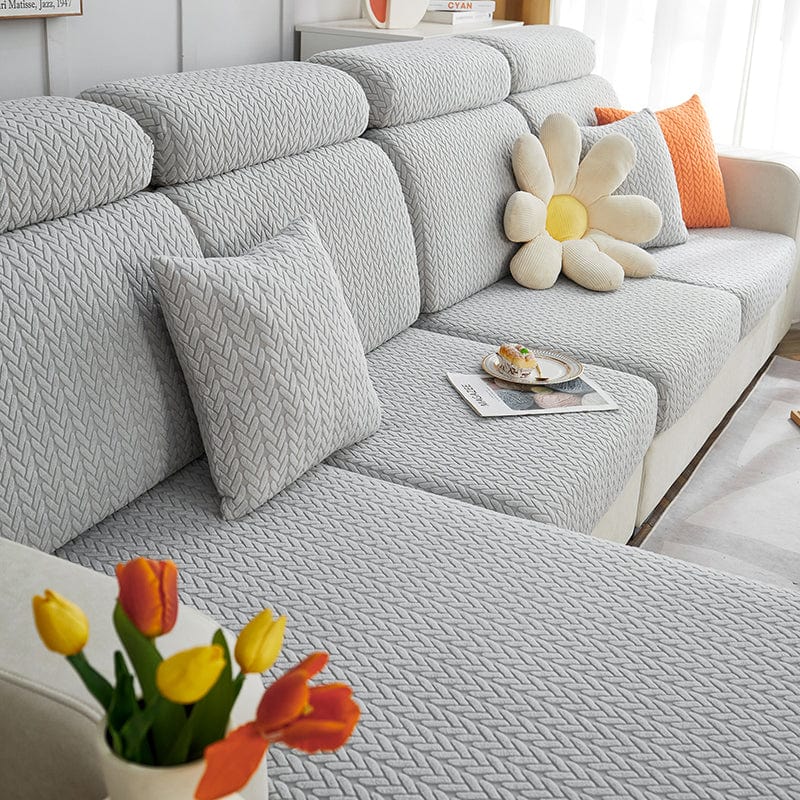 Housse de coussin gris clair en laine avec motif élégant