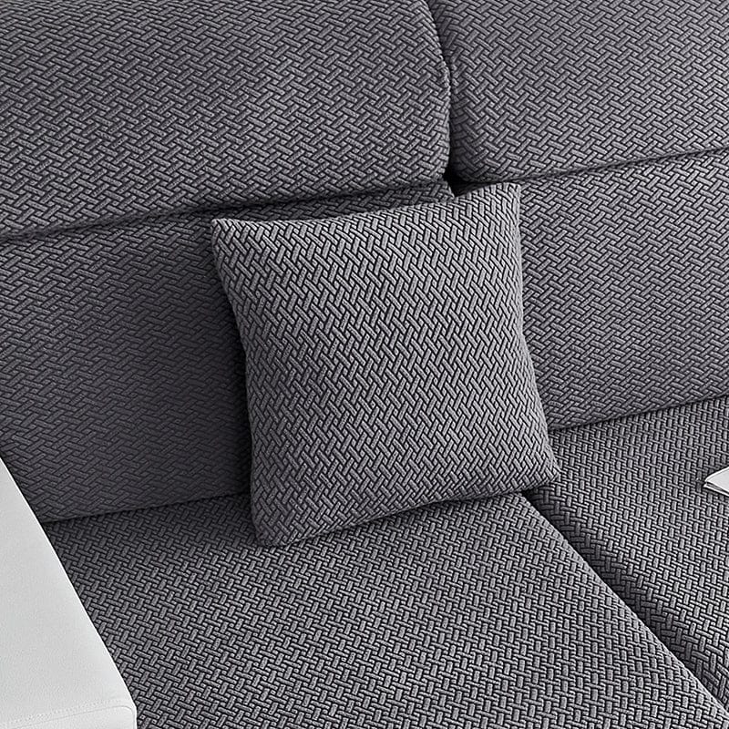 Housse de coussin en laine grise sur canapé moderne