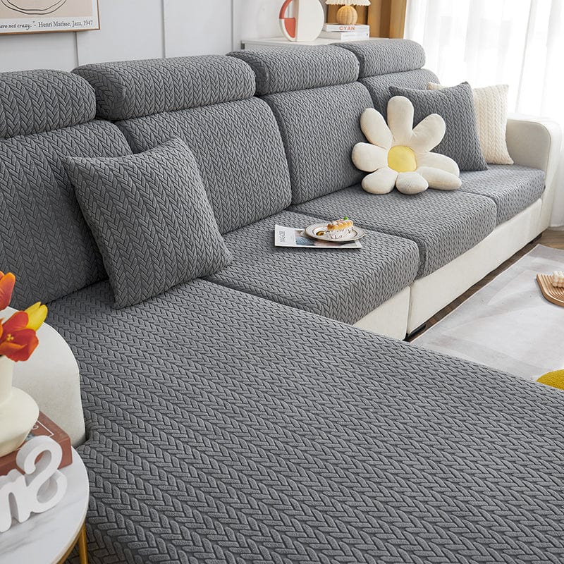 Housse de coussin en laine grise avec motif géométrique