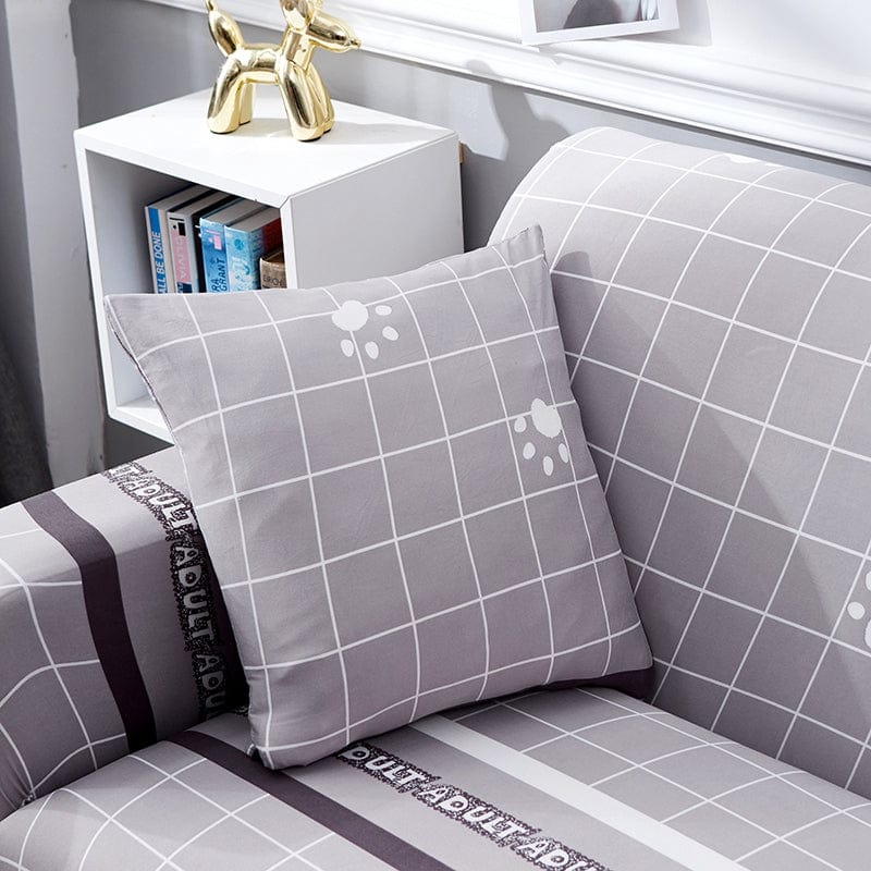 Housse de coussin grise extensible sur canapé