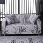 Housses de coussin marbrées extensibles sur canapé gris
