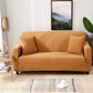Housse de coussin orange sur canapé, tissu déperlant