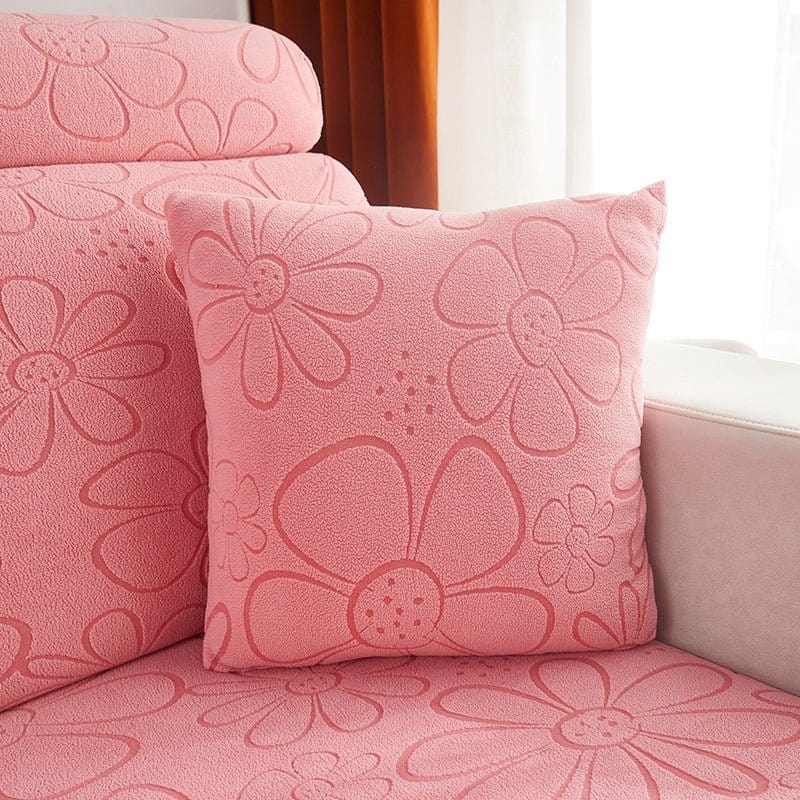 Deux housses de coussin roses en polaire avec motif floral