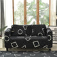 Housse de coussin noire extensible sur canapé clair