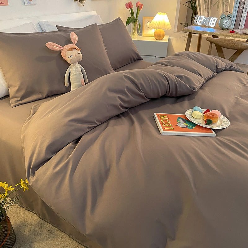 Housse de couette grise étalée, mettant en avant sa respirabilité
