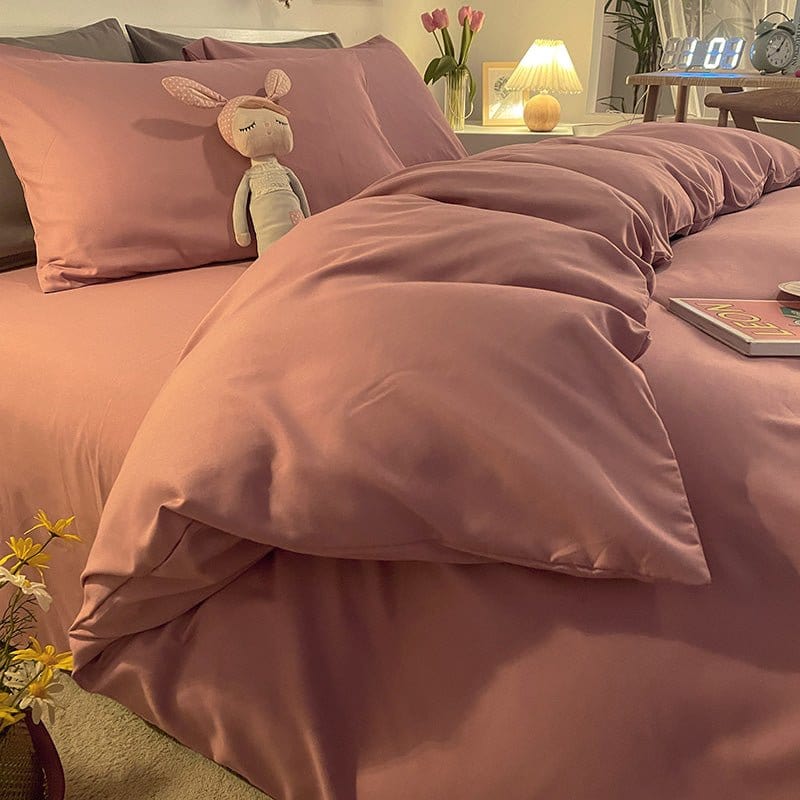 Zoom sur la texture douce de la housse de couette rose