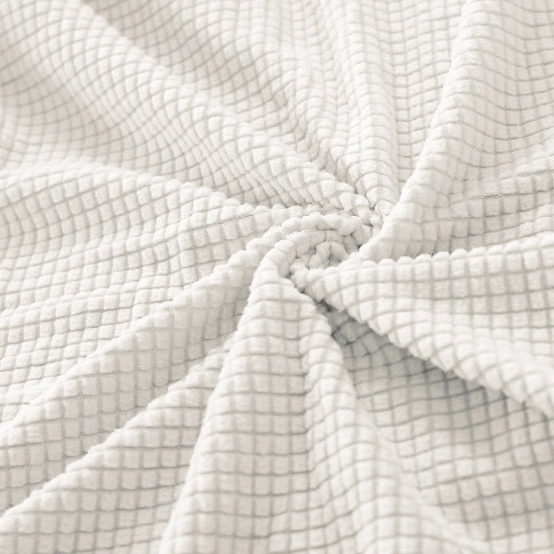 Housse blanche cassée sur fauteuil cabriolet, tissu imperméable