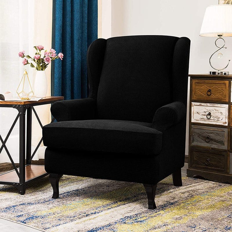 Housse noire en jacquard sur fauteuil à oreilles