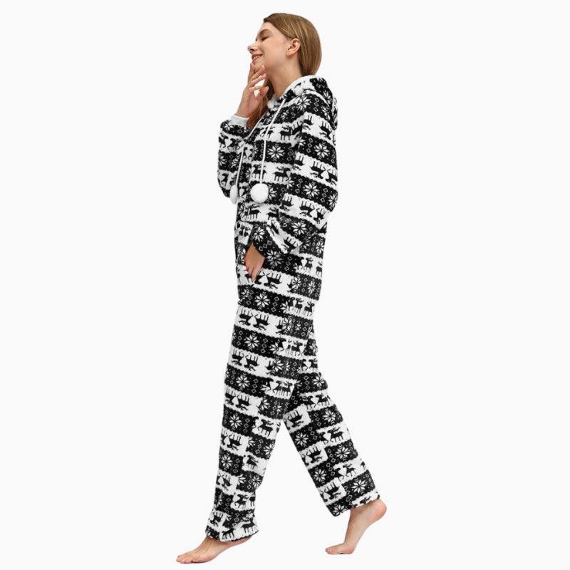 Combinaison noire avec motifs flocons et cerfs de Noël