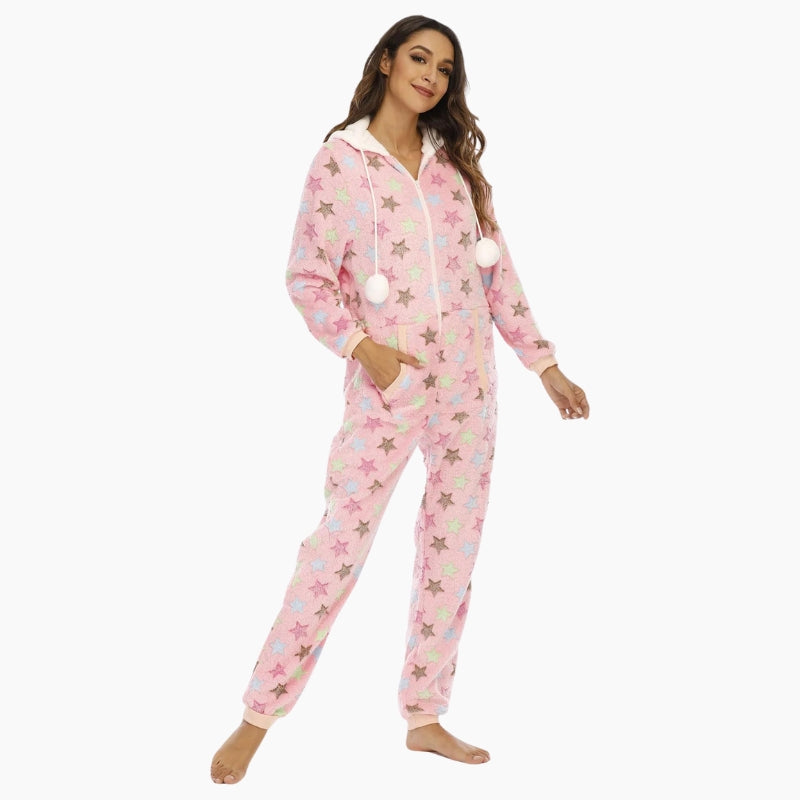 Combinaison rose à motifs étoiles avec capuche et pompons