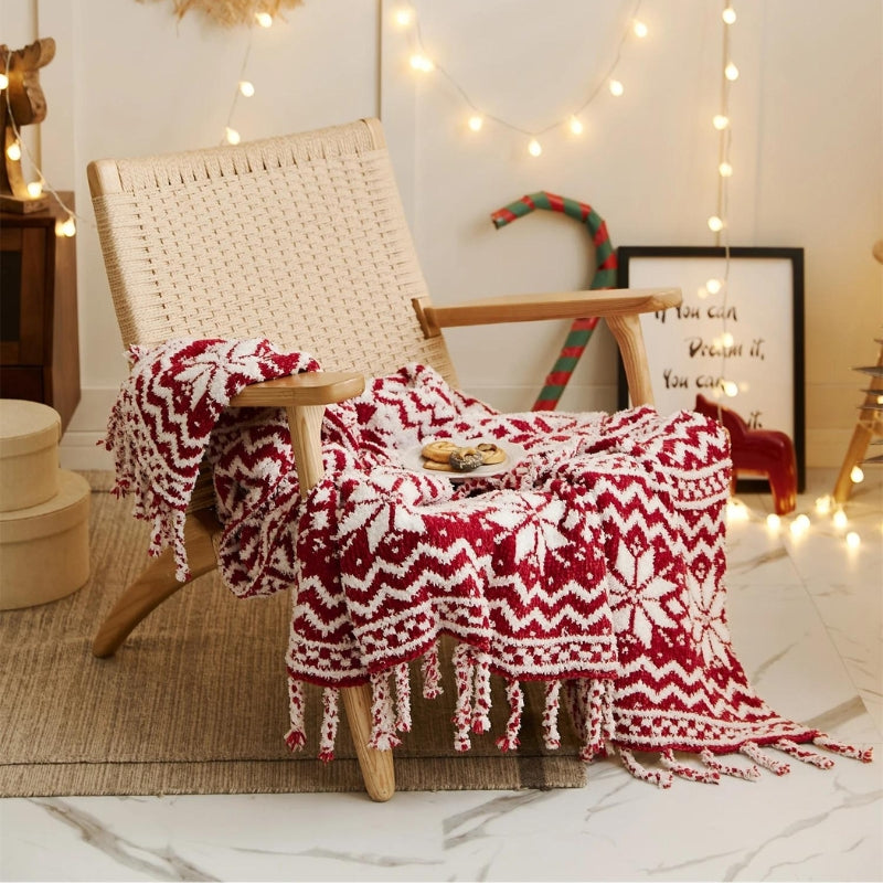 Couverture rouge avec flocons, ambiance chaleureuse de Noël