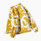 Vue de profil du manteau jaune avec détails blancs