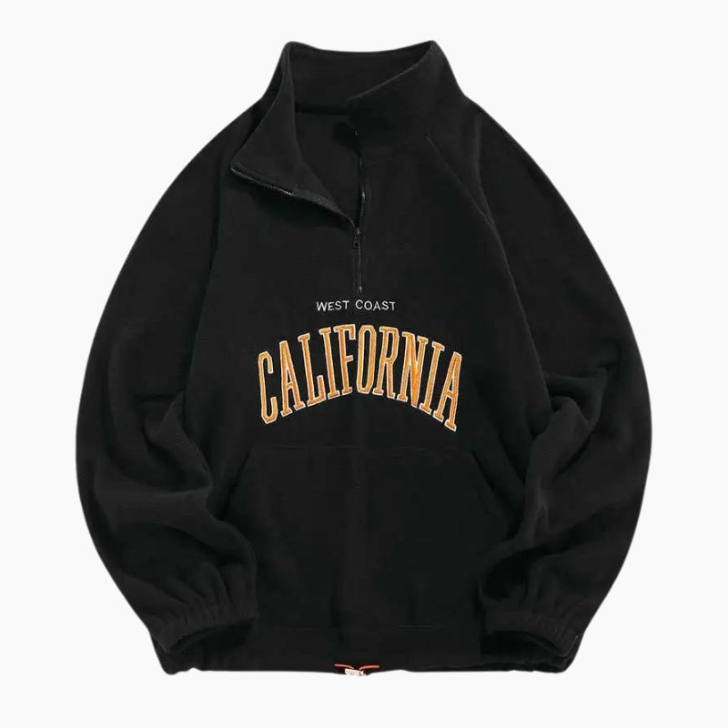 Gros plan sur la texture douce du pull noir à col montant