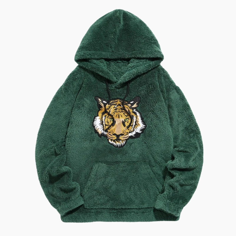 Gros plan sur le motif tigre du pull vert Pilou Pilou