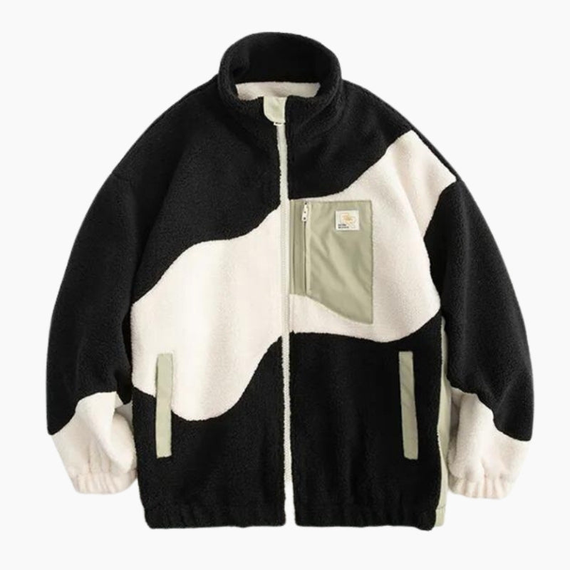 Détail de la veste en peluche noire et blanche pour femme