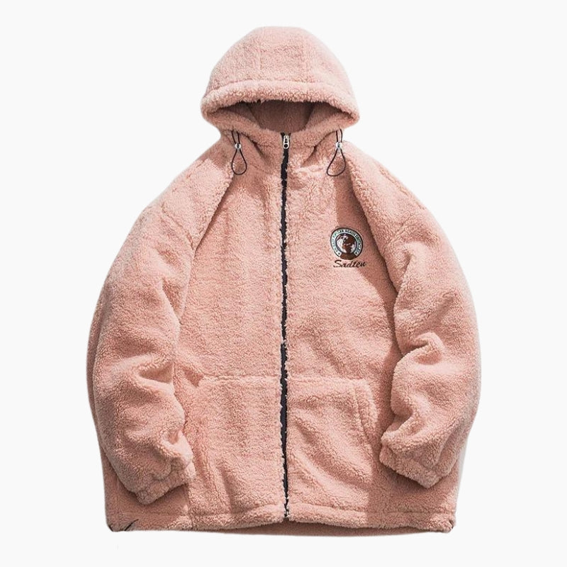Détail de la texture douce de la veste rose