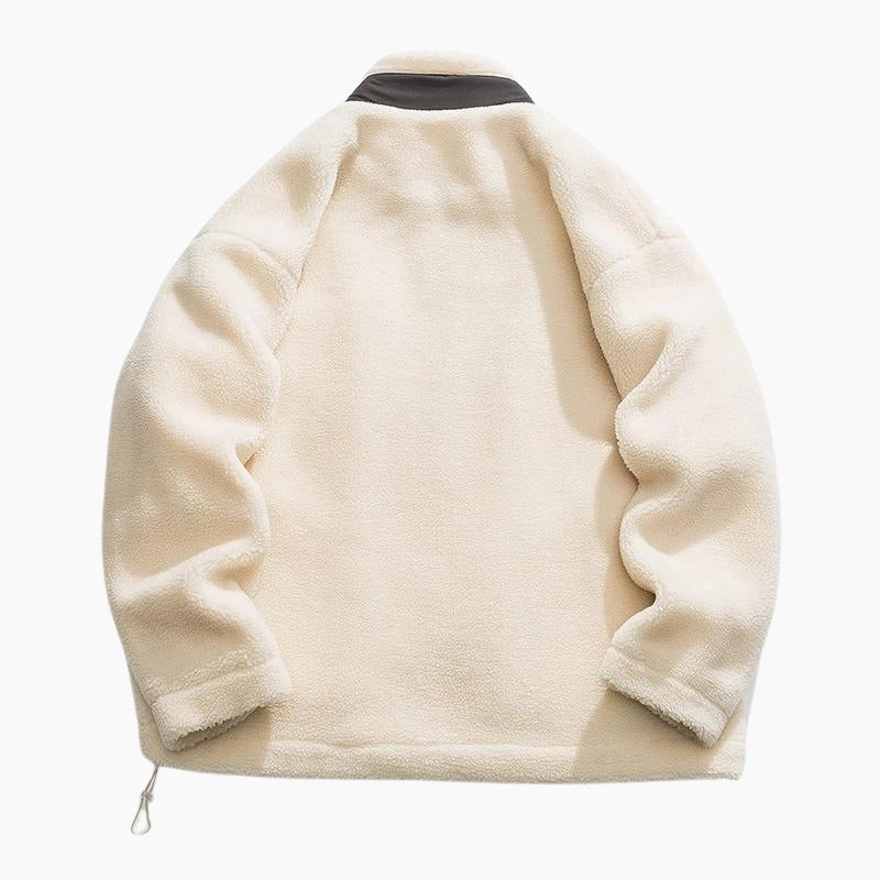 Veste molletonnée crème avec poche poitrine visible