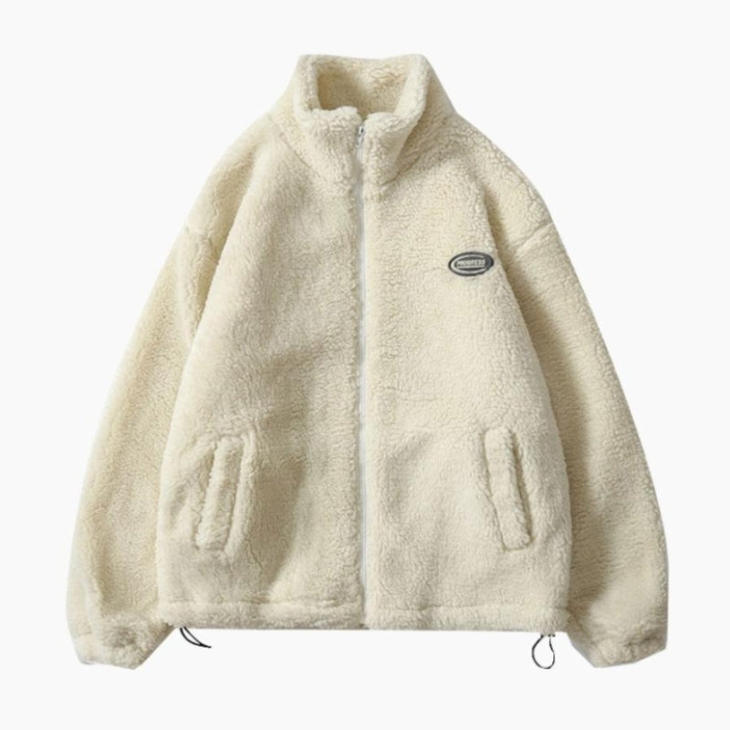 Détail de la fermeture éclair sur veste moumoute blanche